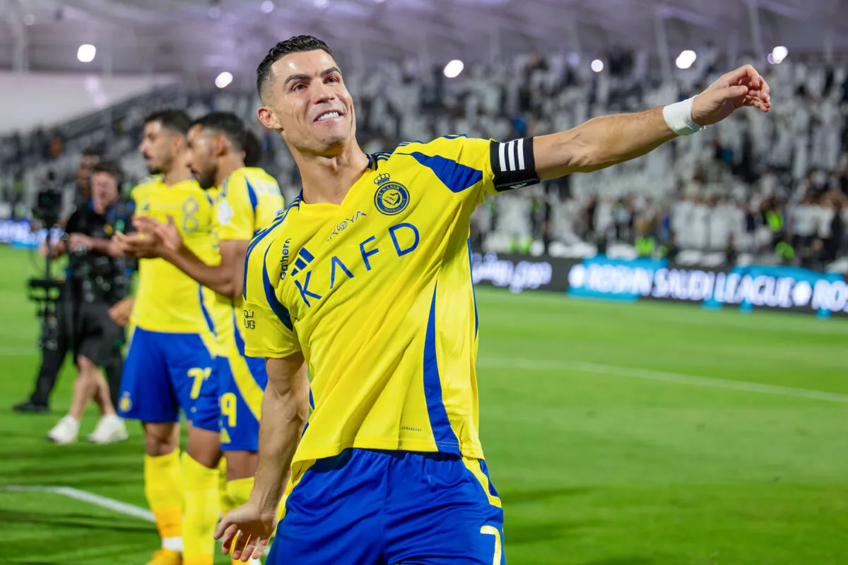 Cristiano Ronaldo of Al Nassr celebrates victory after winning the Saudi Pro League match between Al Shabab v. Al Nassr FC at Al-Shabab Club Stadium in Riyadh, Saudi Arabia, on Oct. 18, 2024. (Yasser Bakhsh/Getty Images)