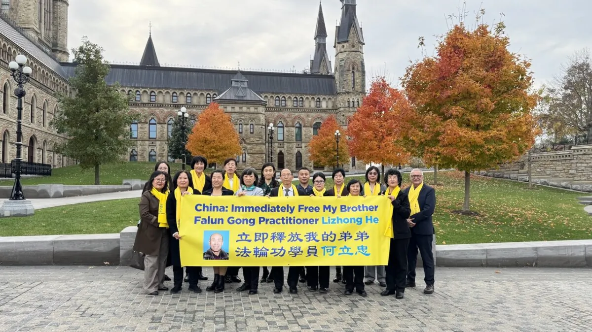 Falun Gong practitioners whose family members have been arbitrarily detained in China for their faith pose for a photo on Parliament Hill on Oct. 30, 2024. That day, MPs presented a petition in the House of Commons calling on the Chinese regime to end its persecution of Falun Gong practitioners. (NTD)