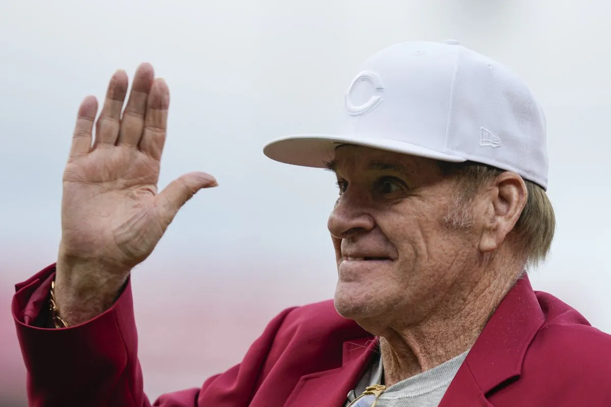 Former Cincinnati Reds player Pete Rose waves to fans after being introduced during the Reds Hall of Fame Induction Ceremony in Cincinnati on July 15, 2023. (Darron Cummings/AP Photo)