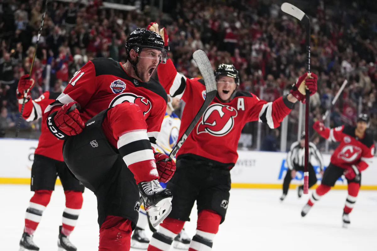 New Jersey Devils' Stefan Noesen, left, celebrates after scoring the opening goal during the NHL hockey game between Buffalo Sabres and New Jersey Devils in Prague, Czech Republic, on Oct. 4, 2024. (Petr David Josek/AP Photo)