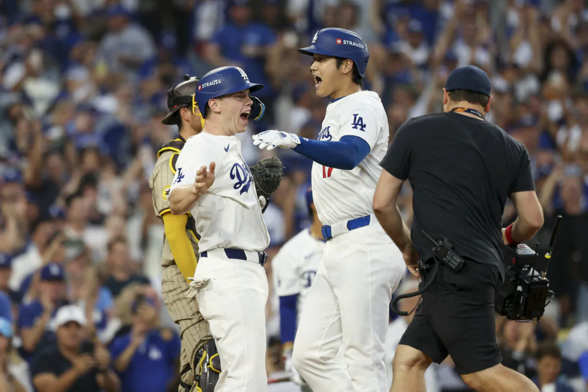 Los Angeles Dodgers catcher Will Smith (16) and designated hitter Shohei Ohtani (17) react after scoring a home run against the San Diego Padres during game one of the NLDS for the 2024 MLB Playoffs at Dodger Stadium in Los Angeles on Oct. 5, 2024. (Kiyoshi Mio/Reuters)
