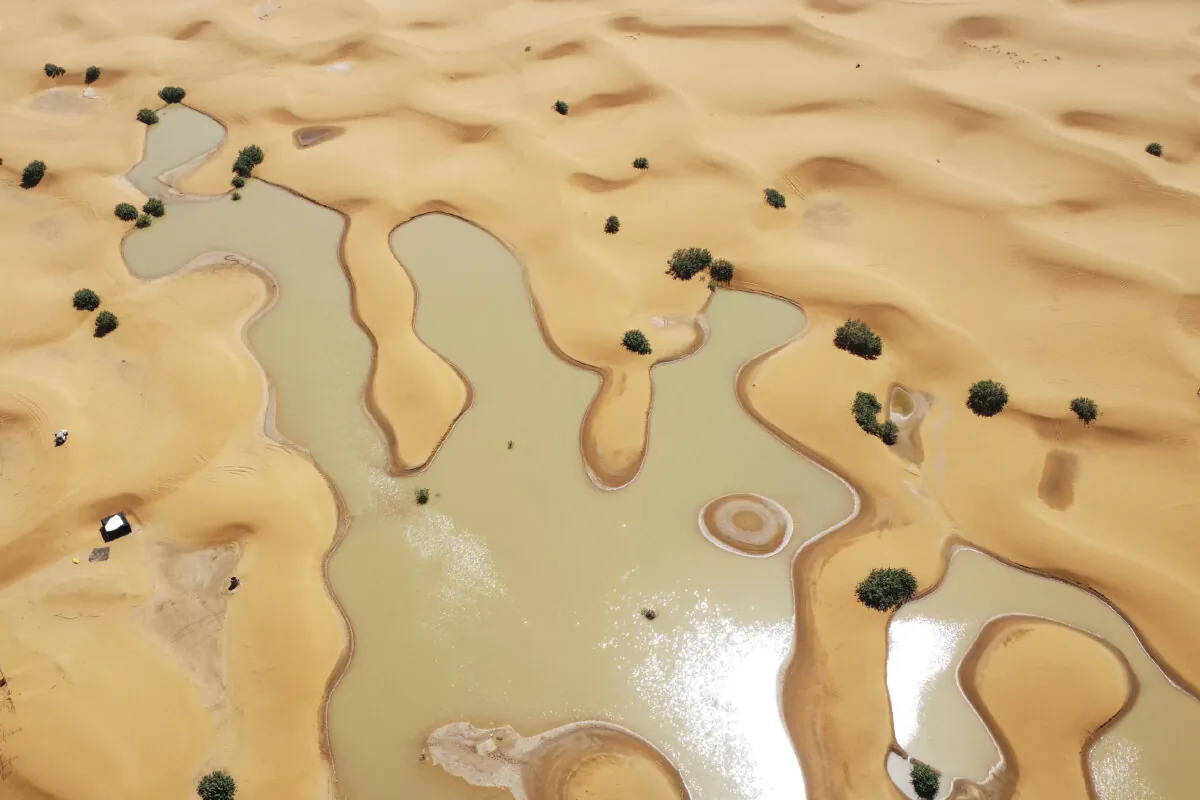 Lakes caused by heavy rainfall between sand dunes in the desert town of Merzouga, near Rachidia, southeastern Morocco, on Oct. 2, 2024. (AP Photo)