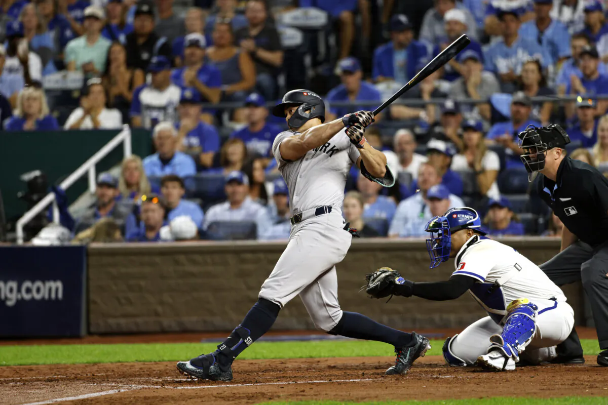 New York Yankees' Giancarlo Stanton hits an RBI double during the fourth inning in Game 3 of an American League Division baseball playoff series against the Kansas City Royals in Kansas City, Mo., on Oct. 9, 2024. (Colin Braley/AP Photo)