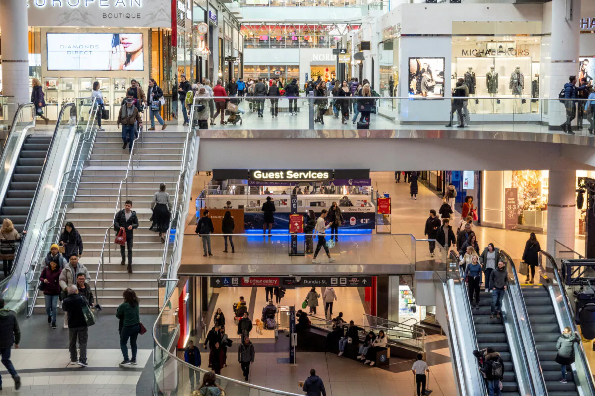 People shop at the Eaton Centre in Toronto, on Nov. 22, 2022.  (REUTERS/Carlos Osorio/File Photo)