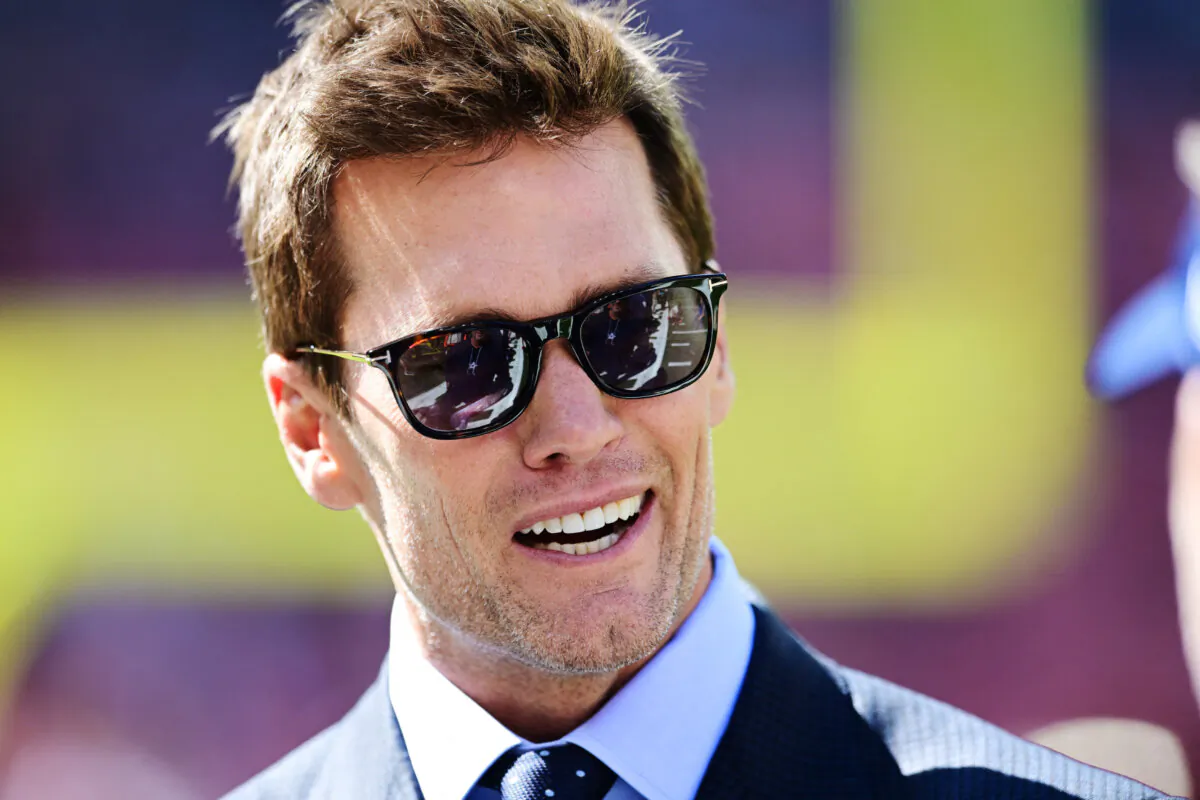 Fox Sports broadcaster Tom Brady talks on the field before the game between the Cleveland Browns and the Dallas Cowboys at Huntington Bank Field in Cleveland, Ohio, on Sept. 8, 2024. (Ken Blaze/Imagn Images via Reuters)