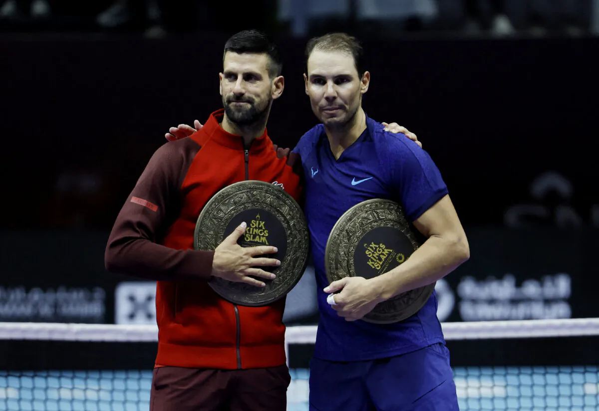 Novak Djokovic of Serbia (L) poses for a photo with Rafael Nadal of Spain after defeating him to win the Men's Singles Third Place Playoff match on day three of the Six Kings Slam 2024 at Kingdom Arena in Riyadh, Saudi Arabia, on Oct. 19, 2024. (Hamad I Mohammed/Reuters)