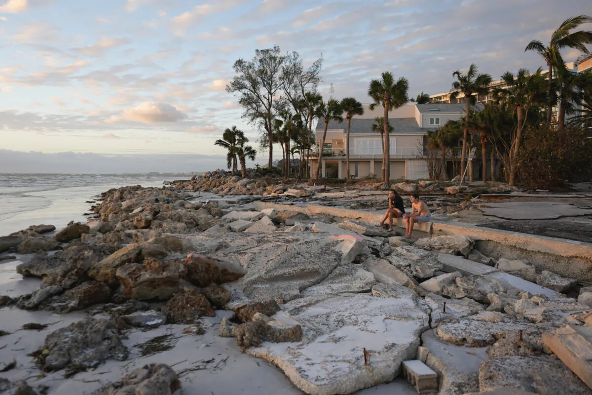 Young people from Sarasota, Fla., visit a familiar beach on Siesta Key, Fla., on Oct. 10, 2024. (Rebecca Blackwell/AP Photo)