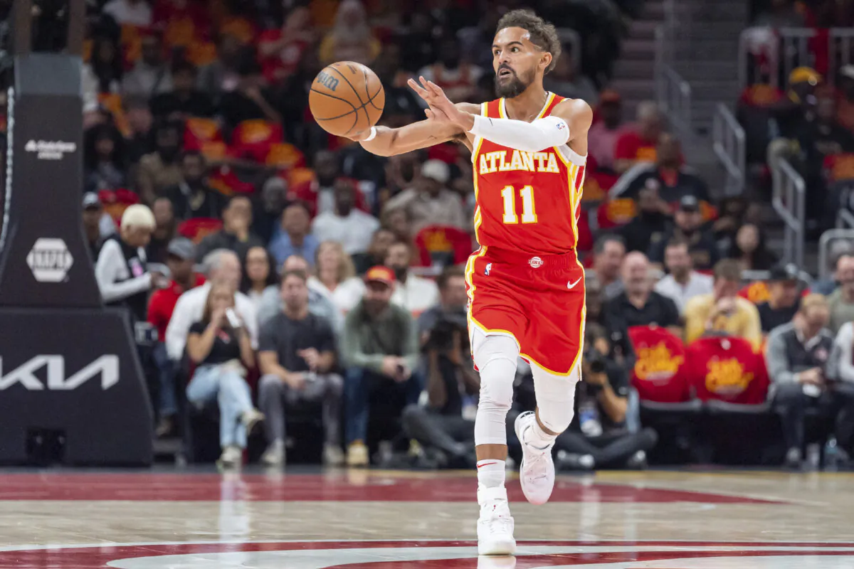 Atlanta Hawks guard Trae Young (11) passes the ball during the first half of an NBA basketball game against the Brooklyn Nets and Atlanta Hawks, Wednesday, Oct. 23, 2024, in Atlanta. (AP Photo/Jason Allen)