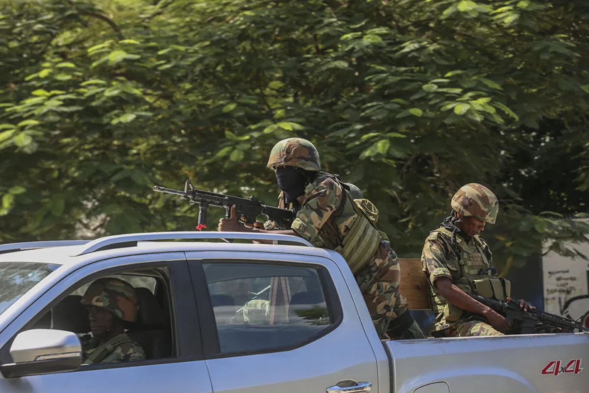 Soldiers patrol amid the sound of gunshots heard in the distance in Port-au-Prince, Haiti, on Oct. 17, 2024. (Odelyn Joseph/AP Photo)