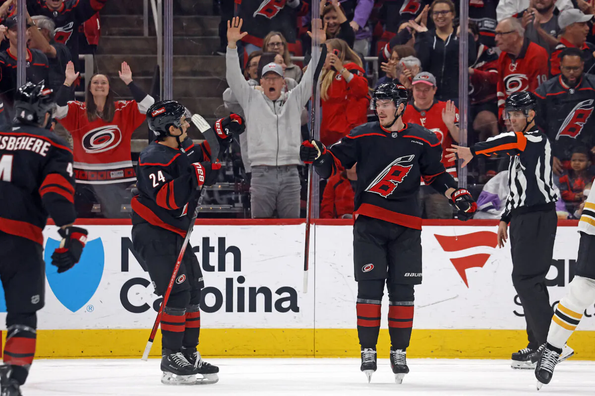 Carolina Hurricanes' Andrei Svechnikov (37) celebrates his goal with Seth Jarvis (24) during the first period of an NHL hockey game against the Boston Bruins in Raleigh, N.C., on Oct. 31, 2024. (Karl B DeBlaker/AP Photo)