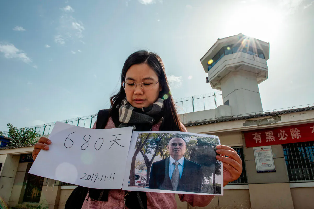 Xu Yan, wife of human rights lawyer Yu Wensheng, making a video for her husband’s birthday in front of the Xuzhou City Detention Centre in this picture taken on Oct. 30, 2019. (Nicolas Asfouri/AFP via Getty Images)