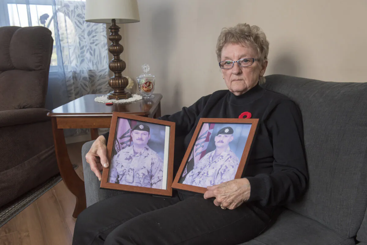 National Silver Cross Mother Maureen Anderson is shown with photos of her sons Sgt. Ron Anderson (L) and Sgt. Ryan Anderson, in her home in Oromocto, New Brunswick on Oct. 31, 2024. (The Canadian Press/Stephen MacGillivray)