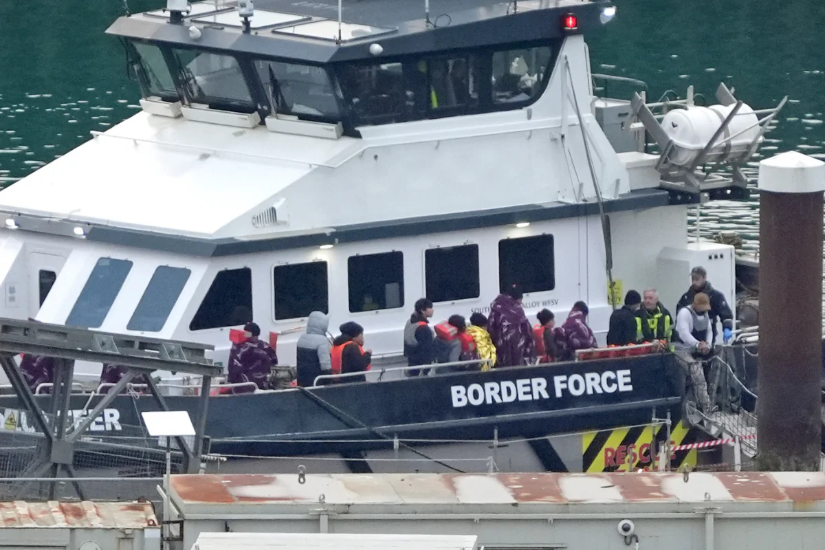 A group of illegal immigrants brought in to shore by a Border Force vessel following a small boat incident in the English Channel, in Dover, Kent, England, on Oct. 31, 2024. (Gareth Fuller/PA Wire)

