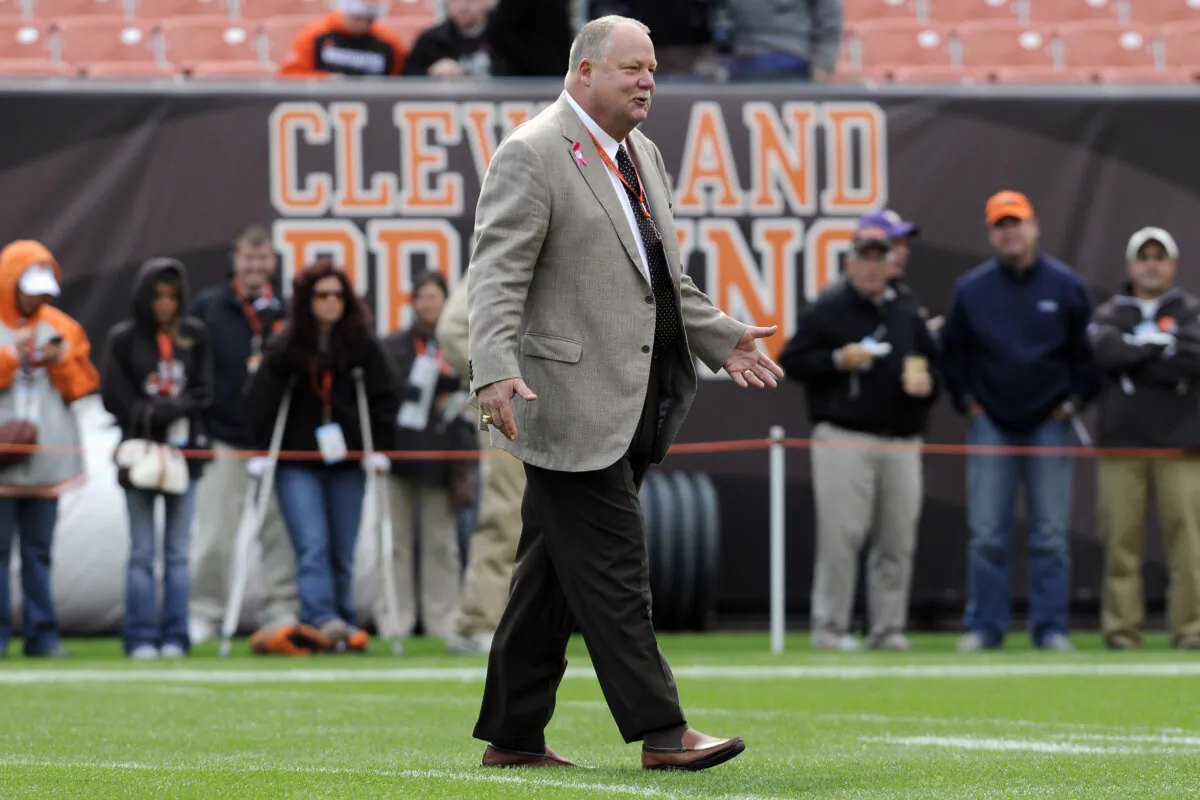 Cleveland Browns President Mike Holmgren greets people on the field prior to to the game between the Cleveland Browns and the Tennessee Titans at Cleveland Browns Stadium in Cleveland, Ohio, on Oct. 2, 2011. (Jason Miller/Getty Images)