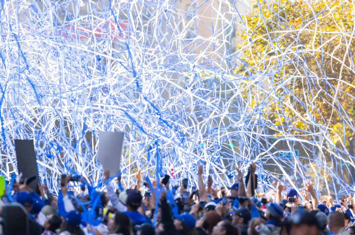 Tens of thousands of Dodger fans flood the streets to celebrate the Dodgers 2024 World Series win in downtown Los Angeles on Nov. 1, 2024. (John Fredricks/The Epoch Times)