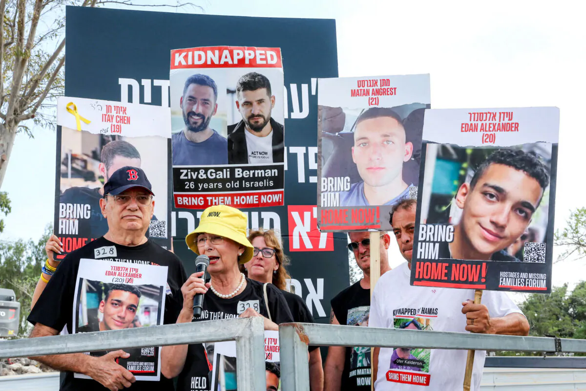 Relatives of Israeli hostage Edan Alexander speak during a demonstration by the families of the hostages taken captive in the Gaza Strip since the Oct. 7 attacks by Hamas calling for the hostages' release, near Kibbutz Nirim in southern Israel by the border with Gaza on Aug. 29, 2024 (Jack Guez/AFP via Getty Images)