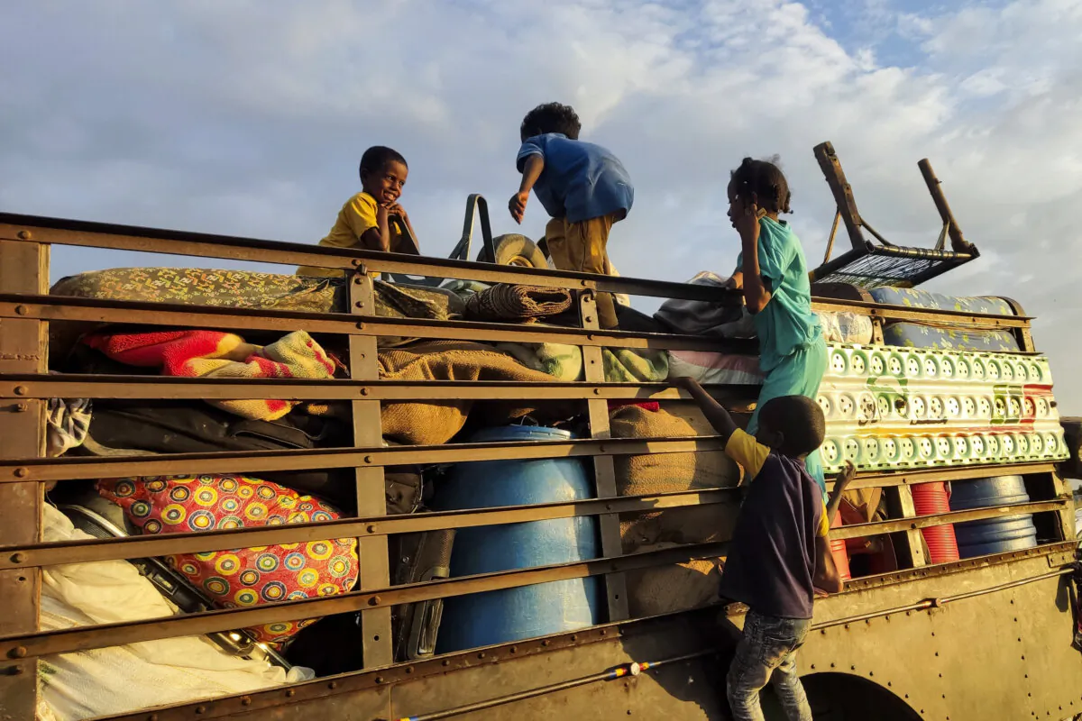 Sudanese children play on a truck as people fleeing the al-Jazira state arrive at an area near the eastern city of Gedaref, Sudan, on Nov. 2, 2024. (AFP via Getty Images)