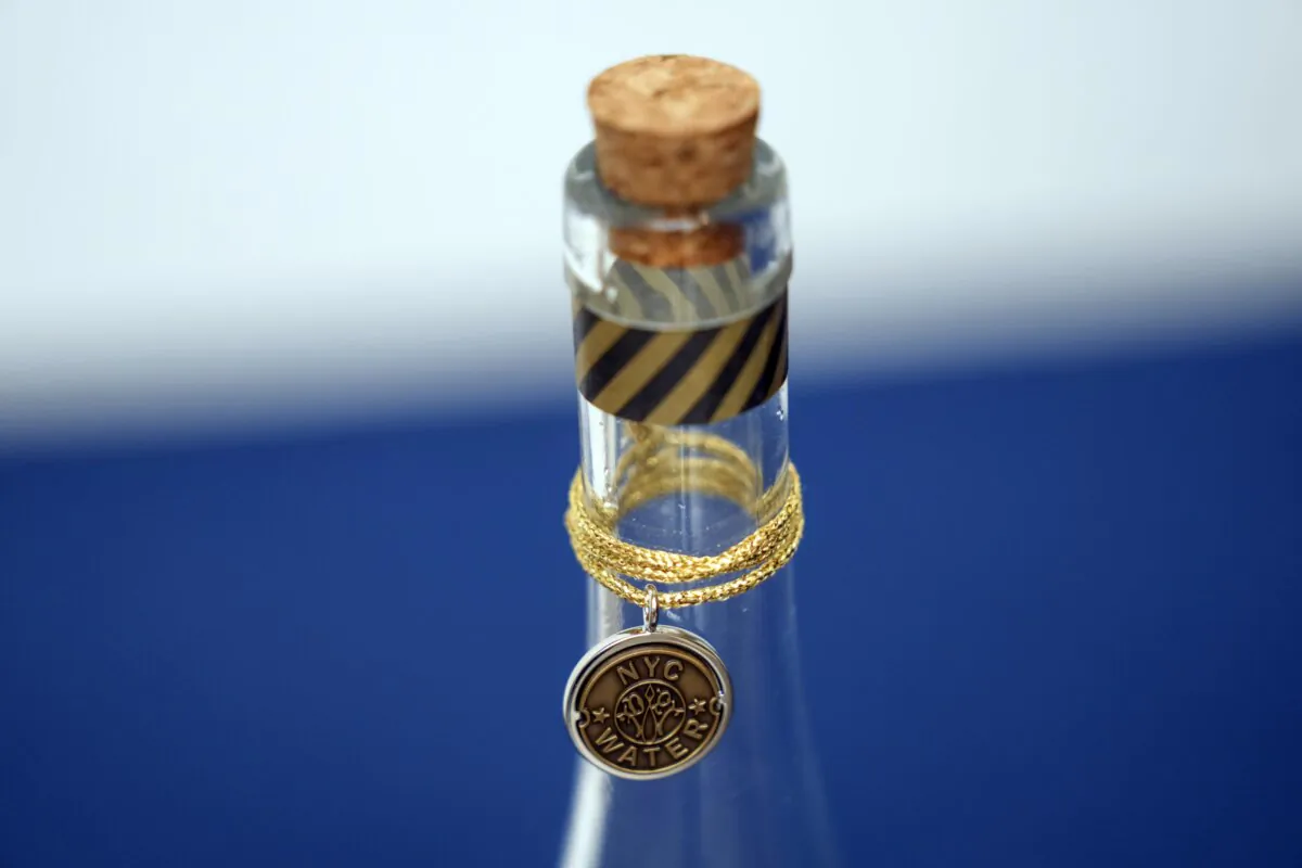 A bottle containing NYC tap water is displayed at a news conference about repairs occurring to the water supply infrastructure in New York, Sept. 30, 2024. (Seth Wenig/AP Photo)