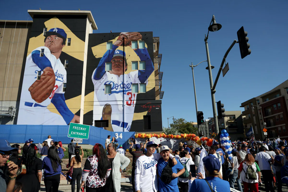 Fans gather during an unveiling of a mural of late Los Angeles Dodgers pitcher Fernando Valenzuela, painted by Robert Vargas, in Los Angeles on Nov. 3, 2024. (Harry How/Getty Images)