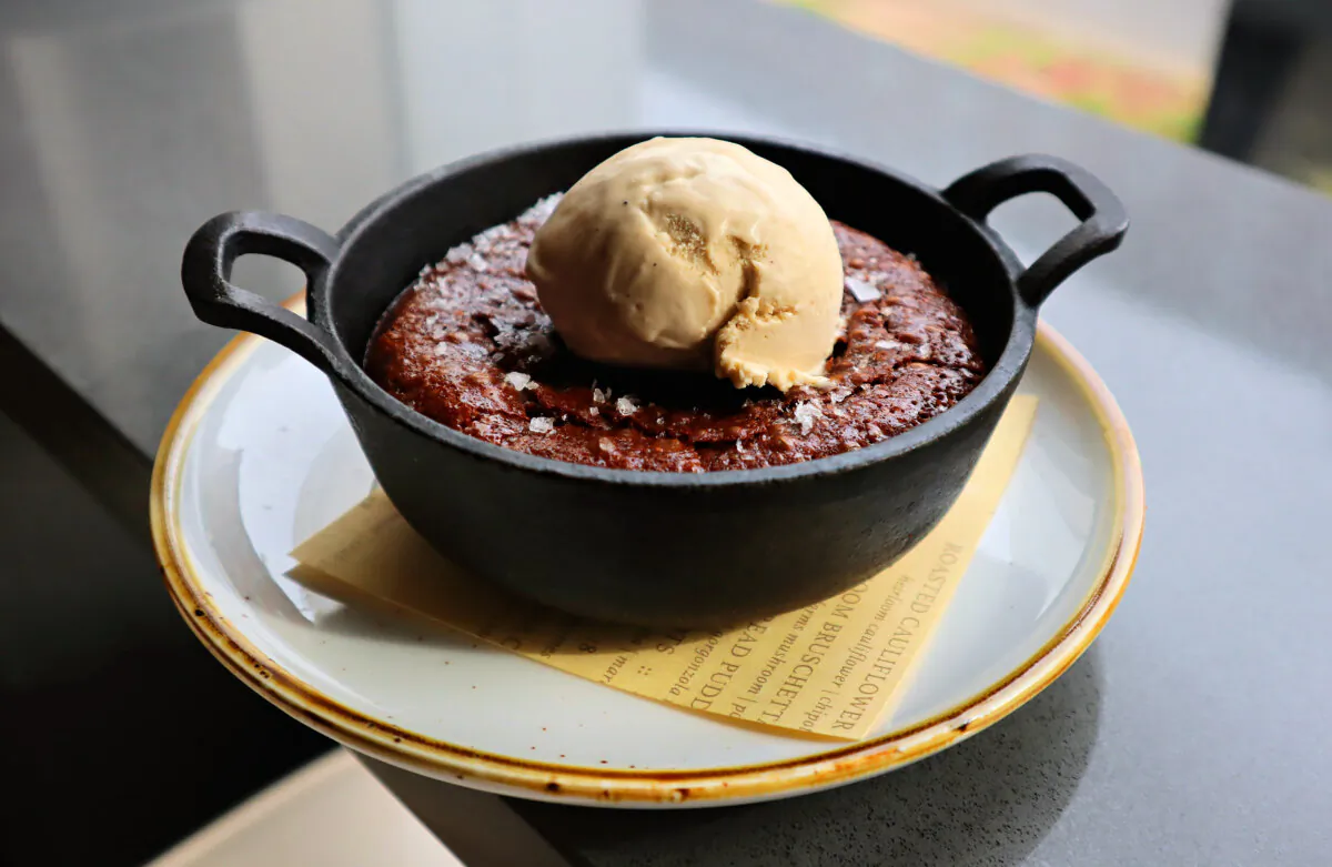 One of Fig & Ash's most popular dishes is its Cast Iron Kahlua Fudge Brownie dessert, which comes topped with Millie’s Coffee Break ice cream and a sprinkle of Maldon sea salt. (Gretchen McKay/Pittsburgh Post-Gazette/TNS)