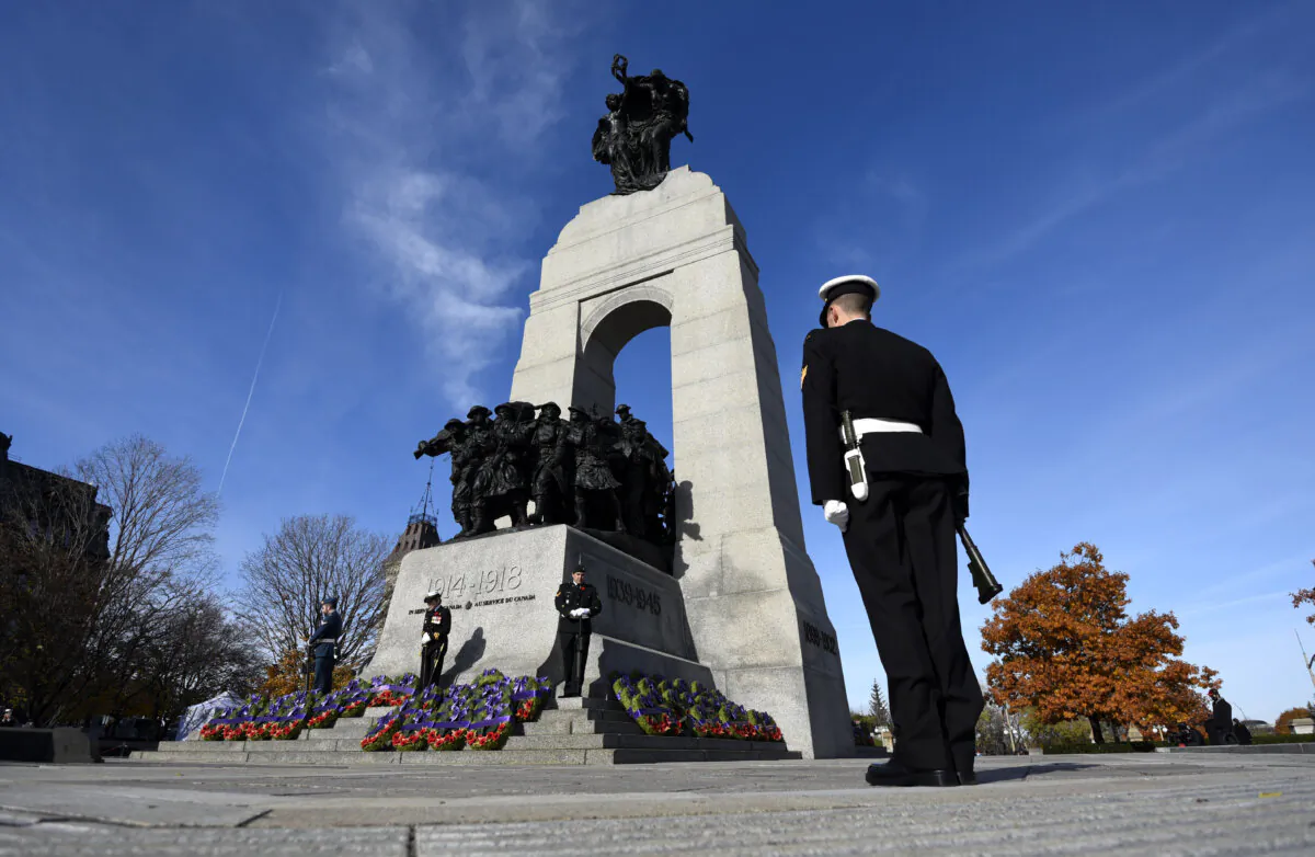 Sentries stand at the National War Memorial in Ottawa during the Remembrance Day ceremony on Nov. 11, 2021. (The Canadian Press/Justin Tang)