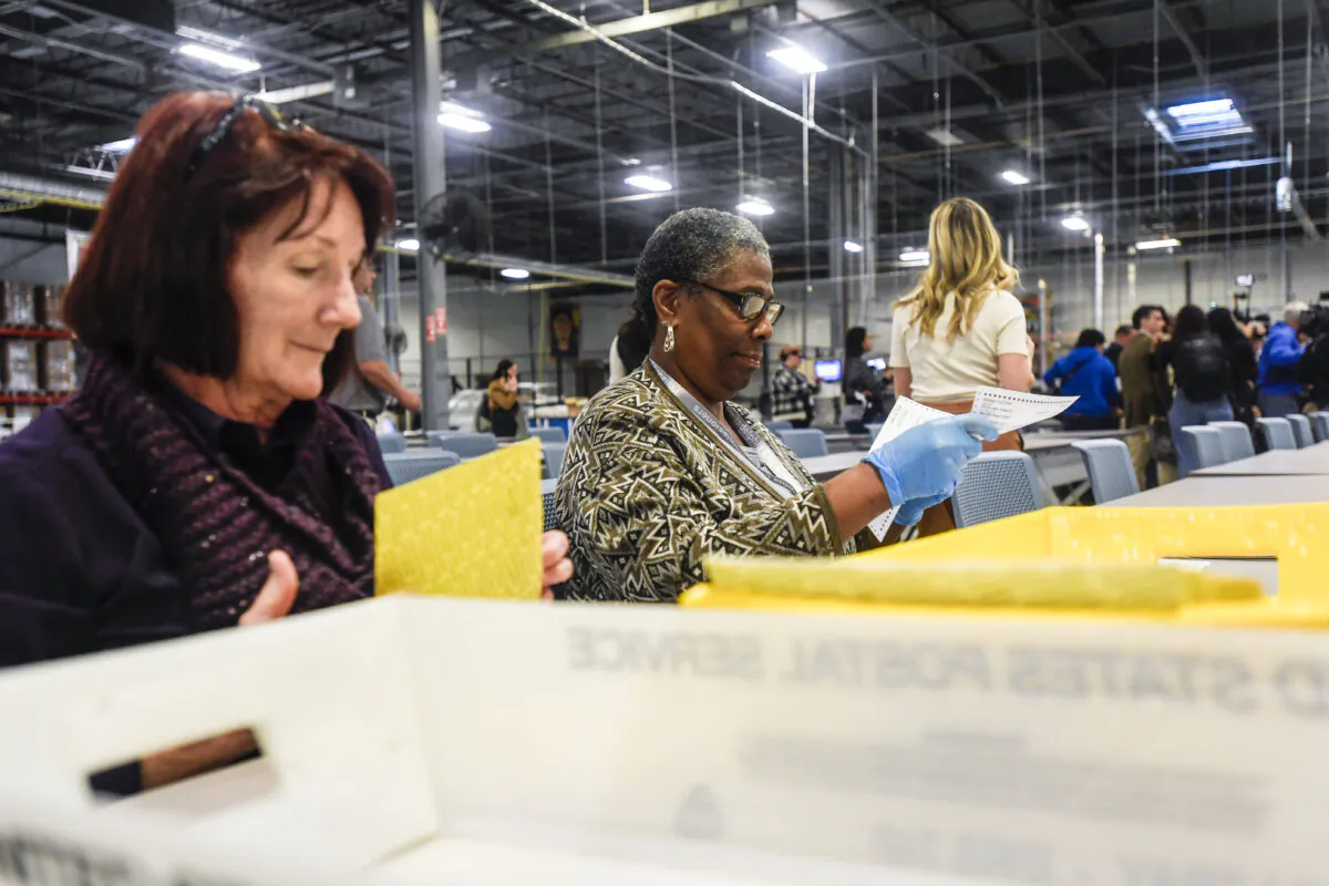 Poll workers demonstrate how ballots are are received, processed, scanned, and securely stored on Election Day at the Philadelphia Election Warehouse during a press tour by the Philadelphia City Commissioners in Philadelphia, Pa., on Oct. 25, 2024. (Matthew Hatcher/Getty Images)