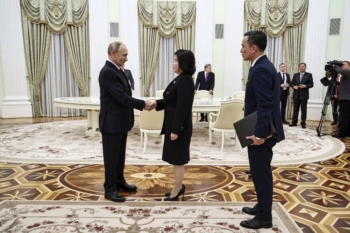 Russian President Vladimir Putin (L) greets North Korean Foreign Minister Choe Son Hui prior to their talks in Moscow on Nov. 4, 2024. (Mikhail Tereshchenko/Pool/AFP via Getty Images)