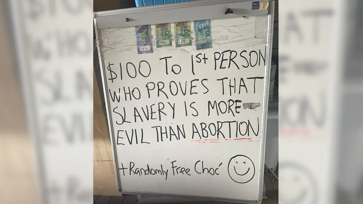 The sign carried by Paul Burns when he was arrested by Police in Wellington, New Zealand. (Courtesy of the New Zealand Free Speech Union)