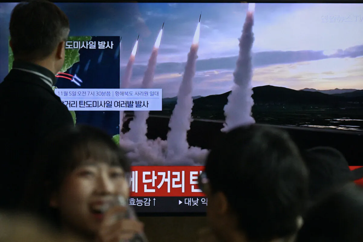 A man watches a television showing a news broadcast with file footage of a North Korean missile test, at a railway station in Seoul on Nov. 5, 2024. (Anthony Wallace/AFP via Getty Images)