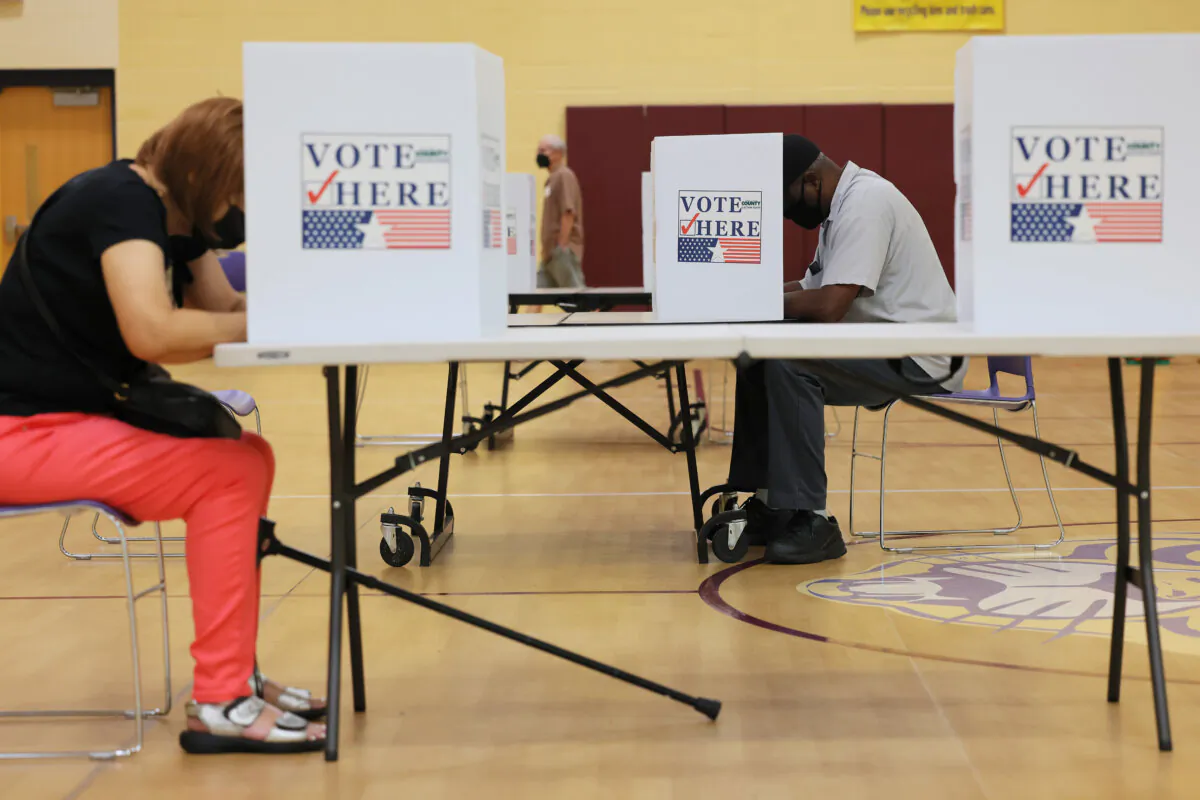 People cast votes in Missouri in a file image. (Michael M. Santiago/Getty Images)