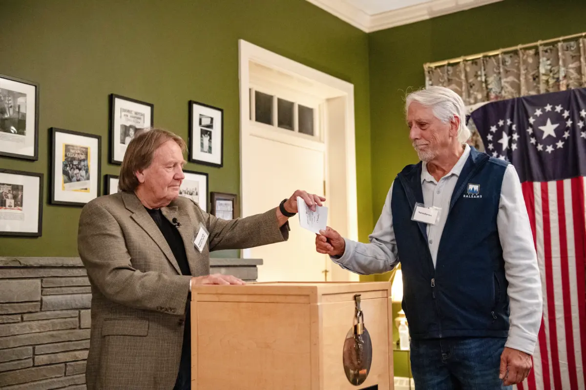 Residents of Dixville Notch cast their ballots in the election at midnight in the living room of the Tillotson House at the Balsams Grand Resort, marking the first votes in the U.S. election, in Dixville Notch, N.H., on Nov. 5, 2024. (Joseph Prezioso/AFP via Getty Images)