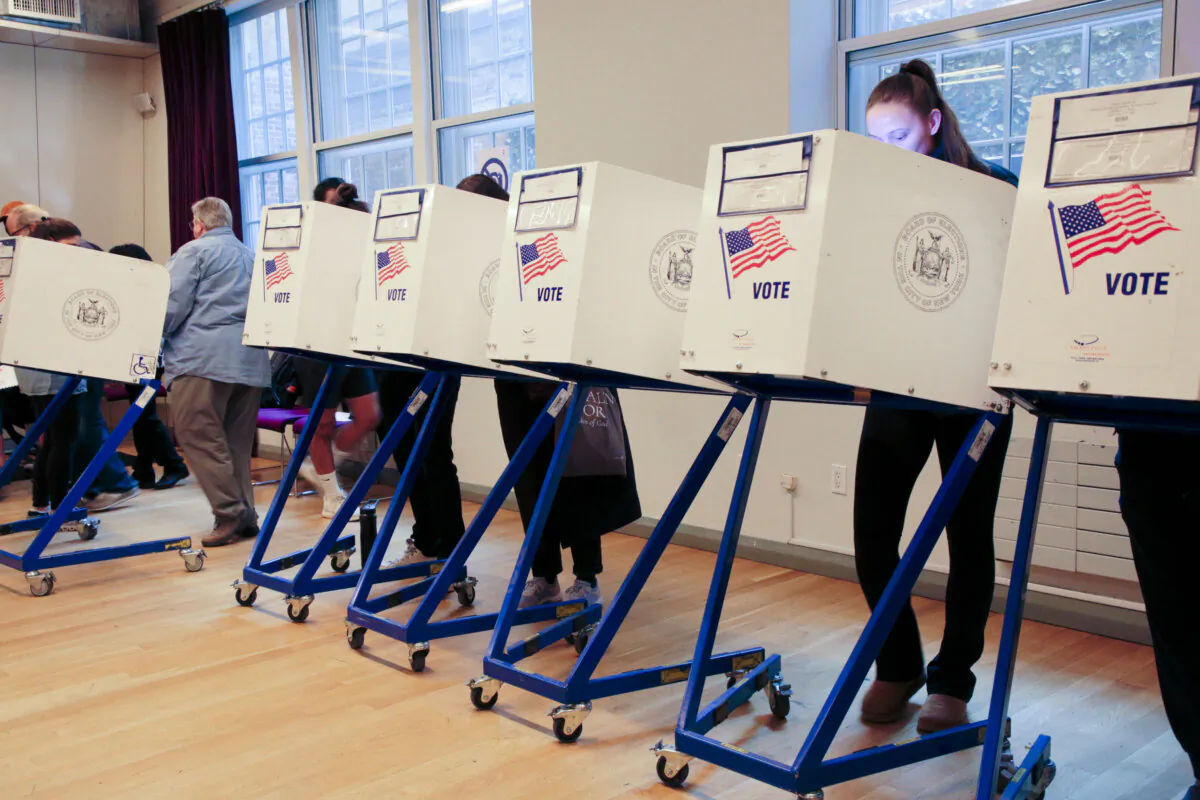 People vote in New York City on Nov. 5, 2024. (Richard Moore/The Epoch Times)