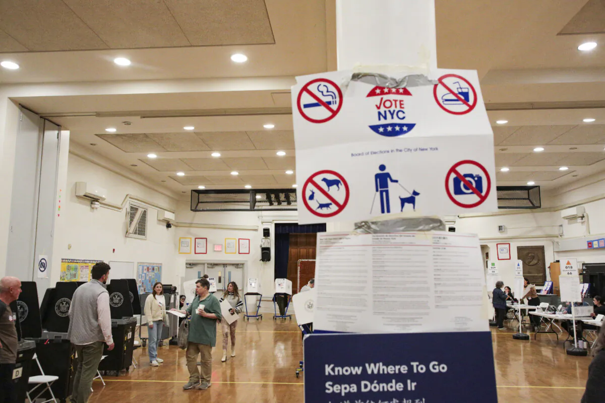 People vote at the West Village polling station in New York City on Nov. 5, 2024. (Richard Moore/The Epoch Times)