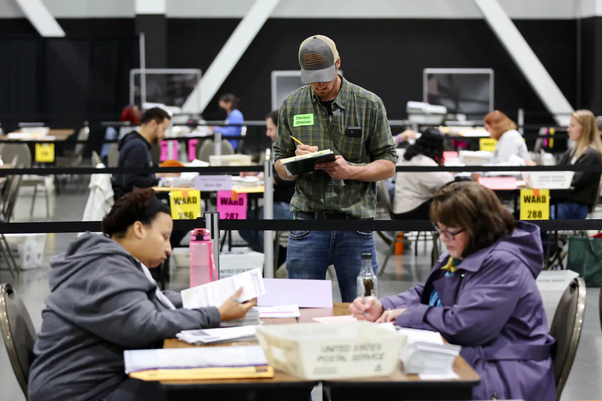 Election observers watch as ballots are counted at the Baird Center on November 05, 2024 in Milwaukee, Wisconsin. Americans cast their ballots today in the presidential race between Republican nominee former President Donald Trump and Democratic nominee Vice President Kamala Harris, as well as multiple state elections that will determine the balance of power in Congress. (Photo by Stacy Revere/Getty Images)