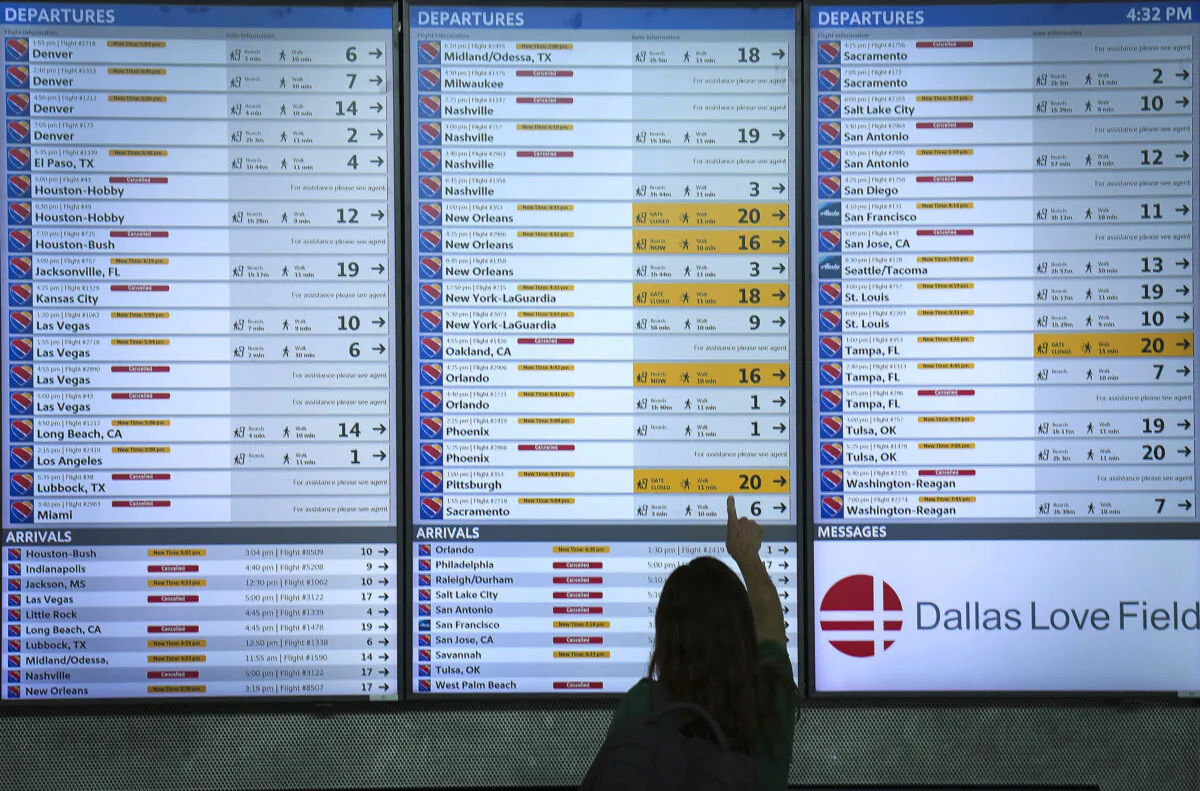 Flight status boards show Southwest flights either cancelled or delayed up and down the board at Dallas Love Field Airport on Monday, July 25, 2022. (Smiley N. Pool/The Dallas Morning News/TNS)