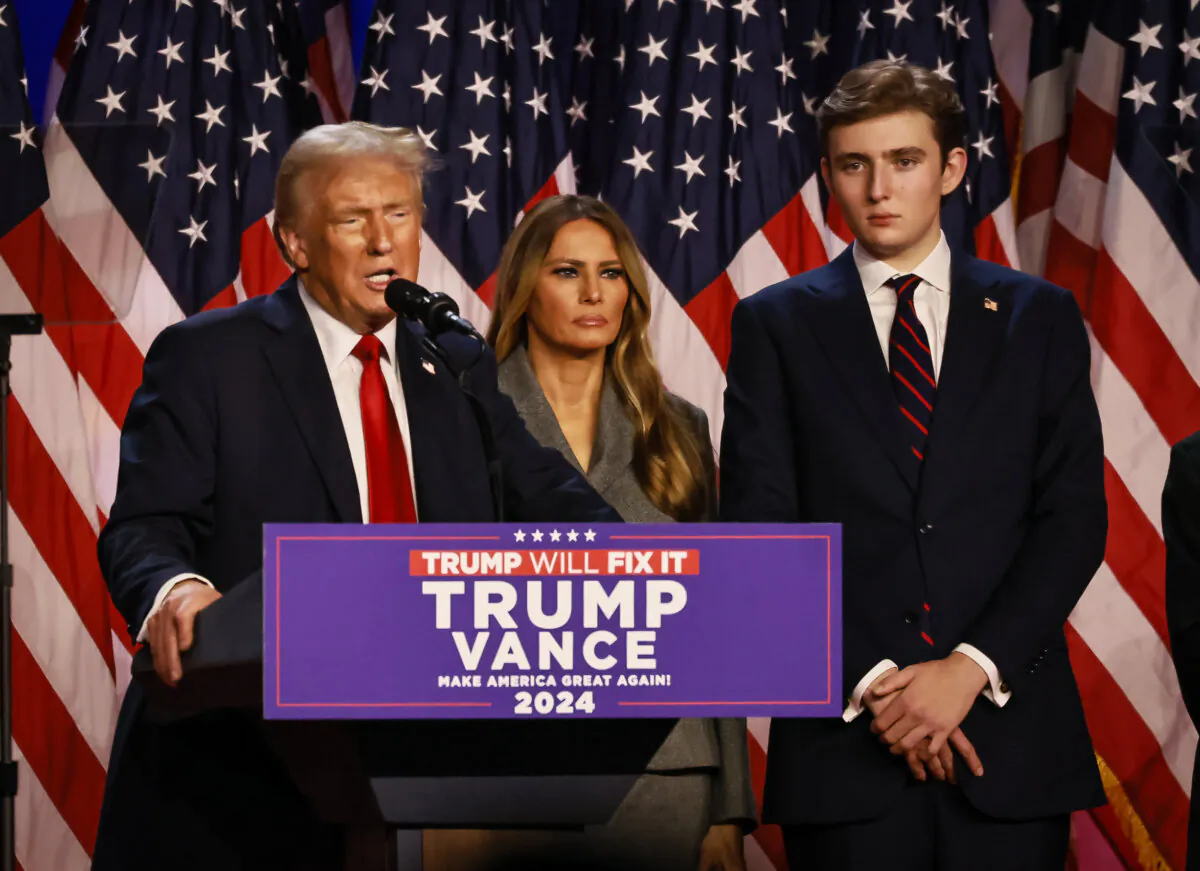 Former President Donald Trump is joined by his family as he declares victory at his election night watch party in West Palm Beach, Fla., on Nov. 6, 2024. (John Fredricks/The Epoch Times)
