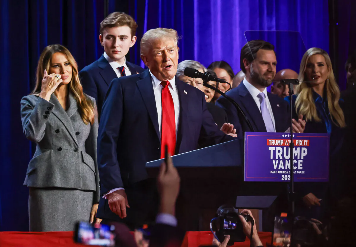 Former President Donald Trump is joined by his family as he declares victory at his election night watch party in West Palm Beach, Fla., on Nov. 6, 2024. (John Fredricks/The Epoch Times)