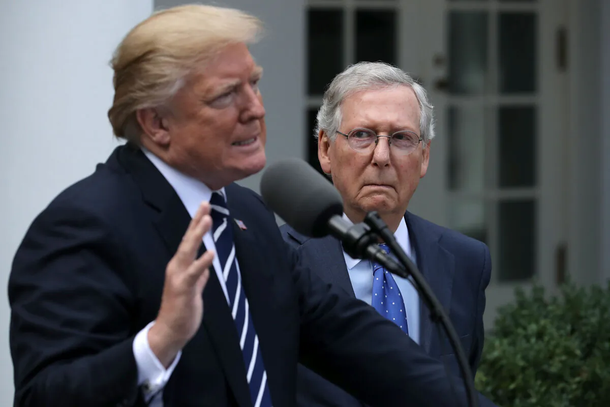 President Donald Trump (L) and Senate Majority Leader Mitch McConnell (R-Ky.) talk to reporters in the Rose Garden following a lunch meeting at the White House on Oct. 16, 2017. (Chip Somodevilla/Getty Images)