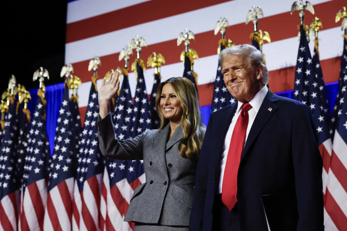 Republican presidential nominee, former President Donald Trump arrives to speak with former first lady Melania Trump during an election night event at the Palm Beach Convention Center in West Palm Beach, Fla., on Nov. 06, 2024. (Chip Somodevilla/Getty Images)