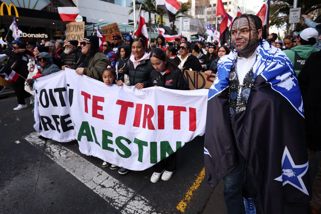 Black Power gang members wearing insignia join a march down Queen St in Auckland, New Zealand, on May 30, 2024. (Fiona Goodall/Getty Images)