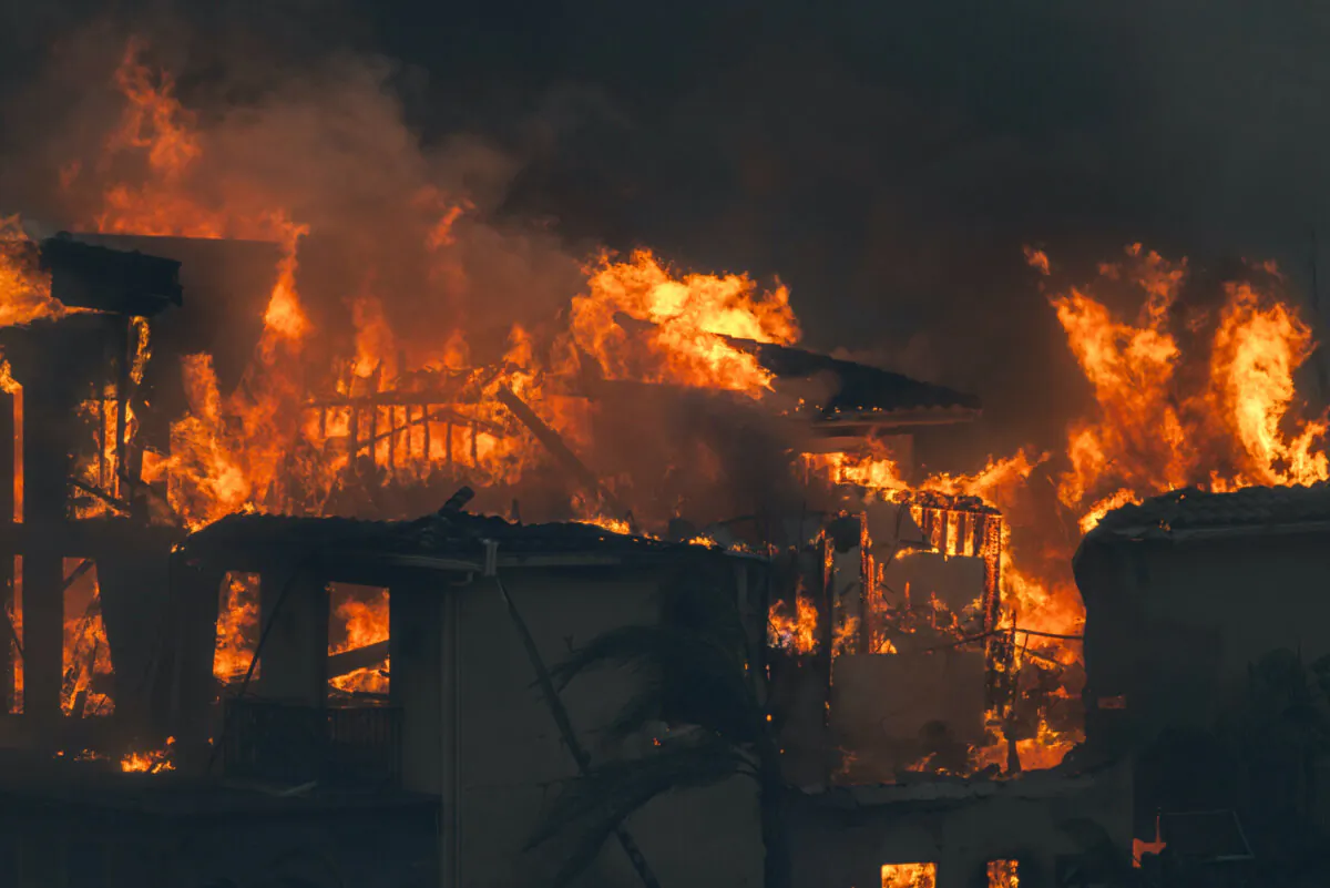 One of numerous homes destroyed by the Mountain Fire goes up in flames in Camarillo, Calif., on Nov. 6, 2024. (David McNew/Getty Images)