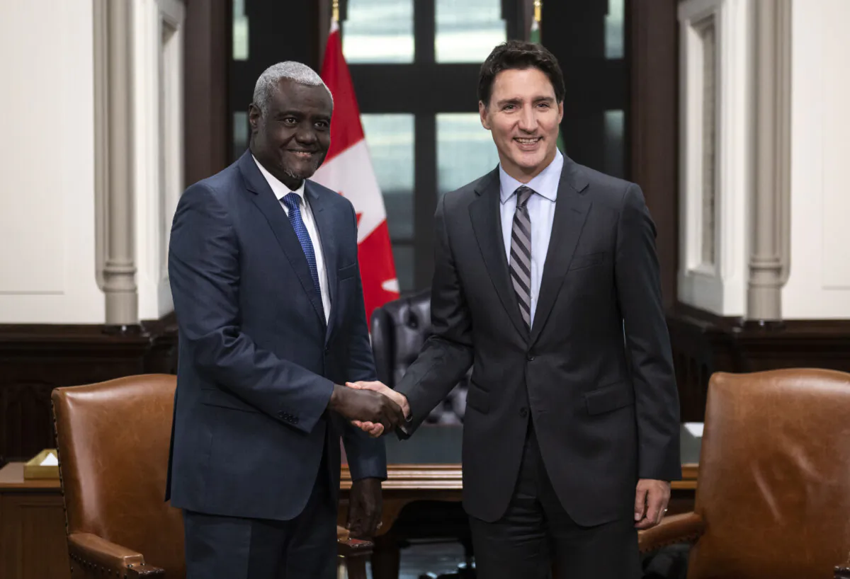 Prime Minister Justin Trudeau shakes hands with Moussa Faki Mahamat, Chairperson of the African Union Commission, as they meet on Parliament Hill in Ottawa on Oct. 26, 2022. (The Canadian Press/Justin Tang)