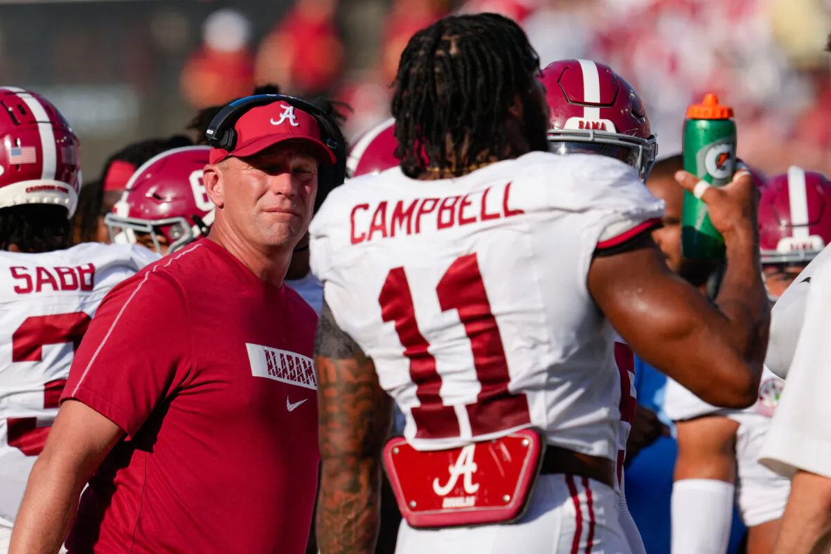 Alabama head coach Kalen DeBoer, left, talks to linebacker Jihaad Campbell (11) during the first half of an NCAA college football game against Vanderbilt , in Nashville, Tenn., on Oct. 5, 2024. (George Walker IV/AP Photo)