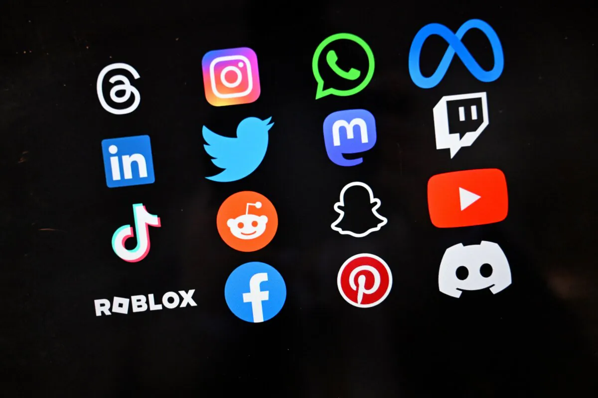 A photo of logos of major social media platforms and companies taken in Canberra, Australia, on Nov. 7, 2024. (AAP Image/Lukas Coch) 