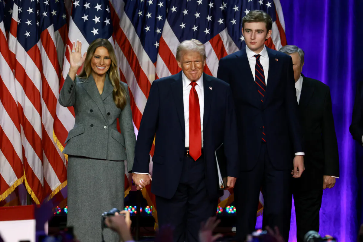 Republican presidential nominee, former U.S. President Donald Trump arrives to speak with former first lady Melania Trump and Barron Trump during an election night event at the Palm Beach Convention Center in West Palm Beach, Fla., on Nov. 6, 2024. (Joe Raedle/Getty Images)