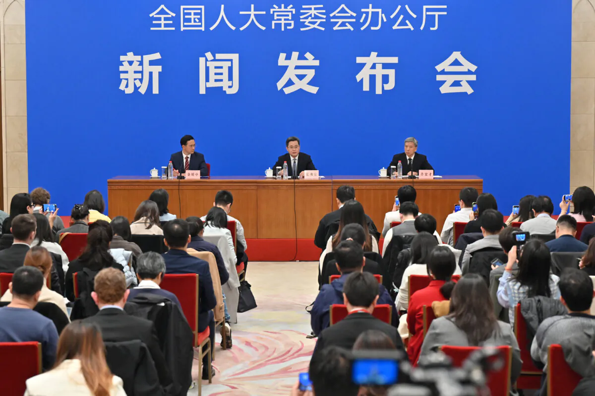 Chinese Finance Minister Lan Fo'an (C) speaks at a press conference in Beijing on Nov. 8, 2024. (Adek Berry/AFP via Getty Images)