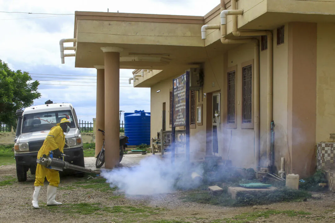 A man disinfects a rural isolation centre where patients are being treated for cholera in Wad Al-Hilu in Kassala state in eastern Sudan, on Aug. 17, 2024. (AFP via Getty Images)