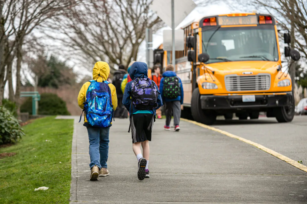 Students leave Thurgood Marshall Elementary school after the Seattle public school system was abruptly closed due to the pandemic, in Seattle on March 11, 2020. (John Moore/Getty Images)