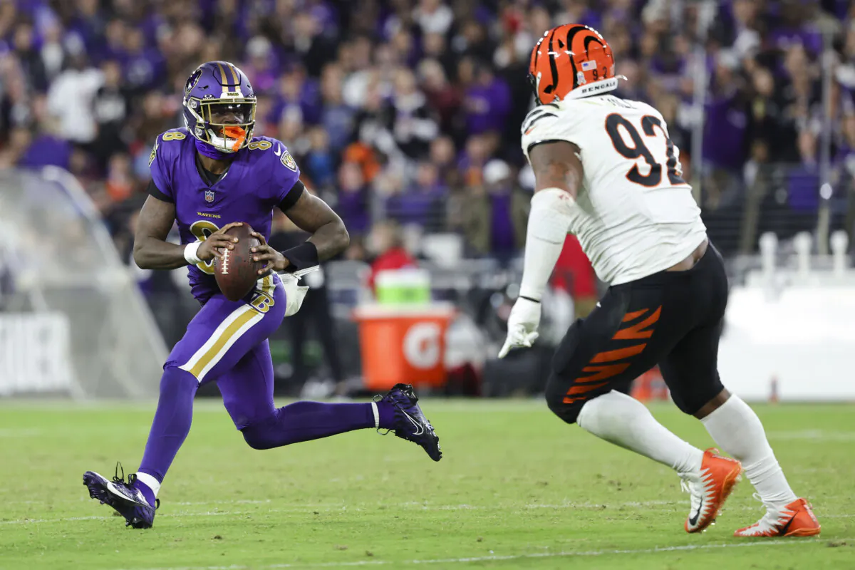 Lamar Jackson #8 of the Baltimore Ravens looks to pass the ball against B.J. Hill #92 of the Cincinnati Bengals during the third quarter at M&T Bank Stadium in Baltimore, Md., on Nov. 7, 2024. (Scott Taetsch/Getty Images)