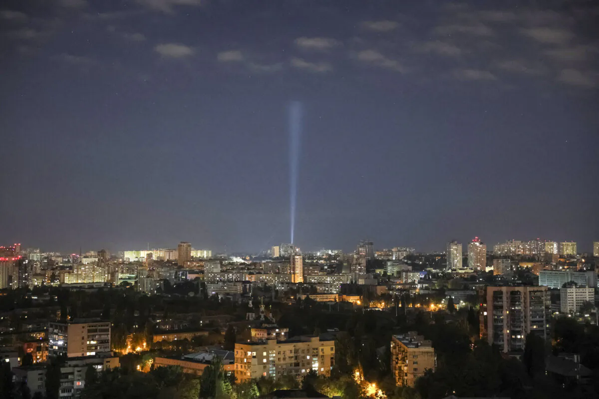Ukrainian service personnel use a searchlight as they search for drones in the sky over the city centre during a Russian drone strike, in Kyiv, amid Russia's attack on Ukraine on Oct. 20, 2024. (Gleb Garanich /Reuters)